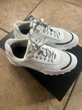 CHANEL White Sneakers with Black Trim